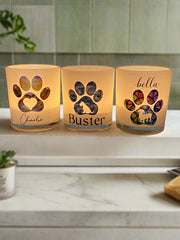 Three cylindrical containers with names 'Bella', 'Buster', and 'Chili' on a wooden surface.